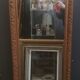 High and narrow mirror in gilded stucco late nineteenth century