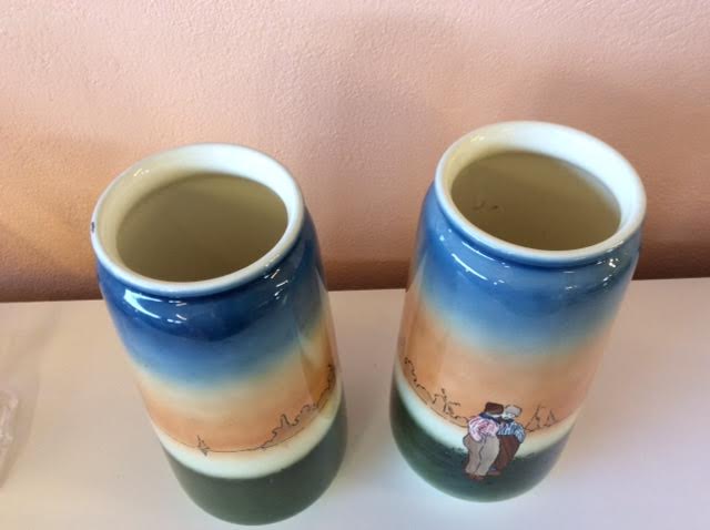 Pair of enamelled sandstone vases