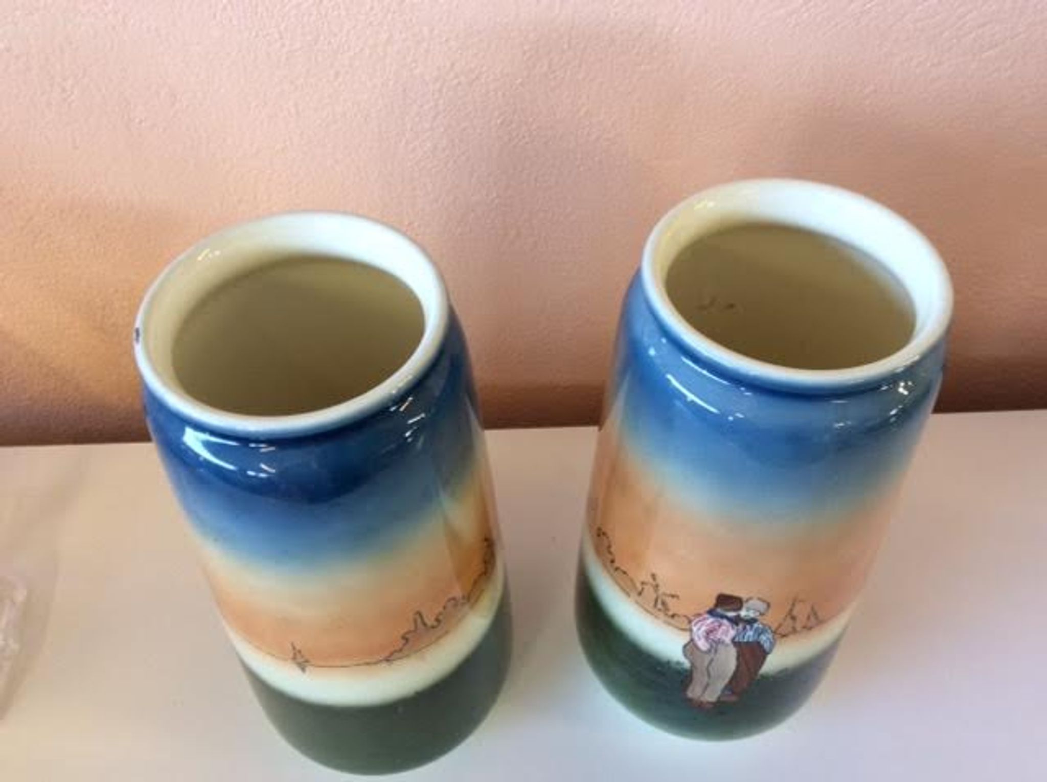 Pair of enamelled sandstone vases