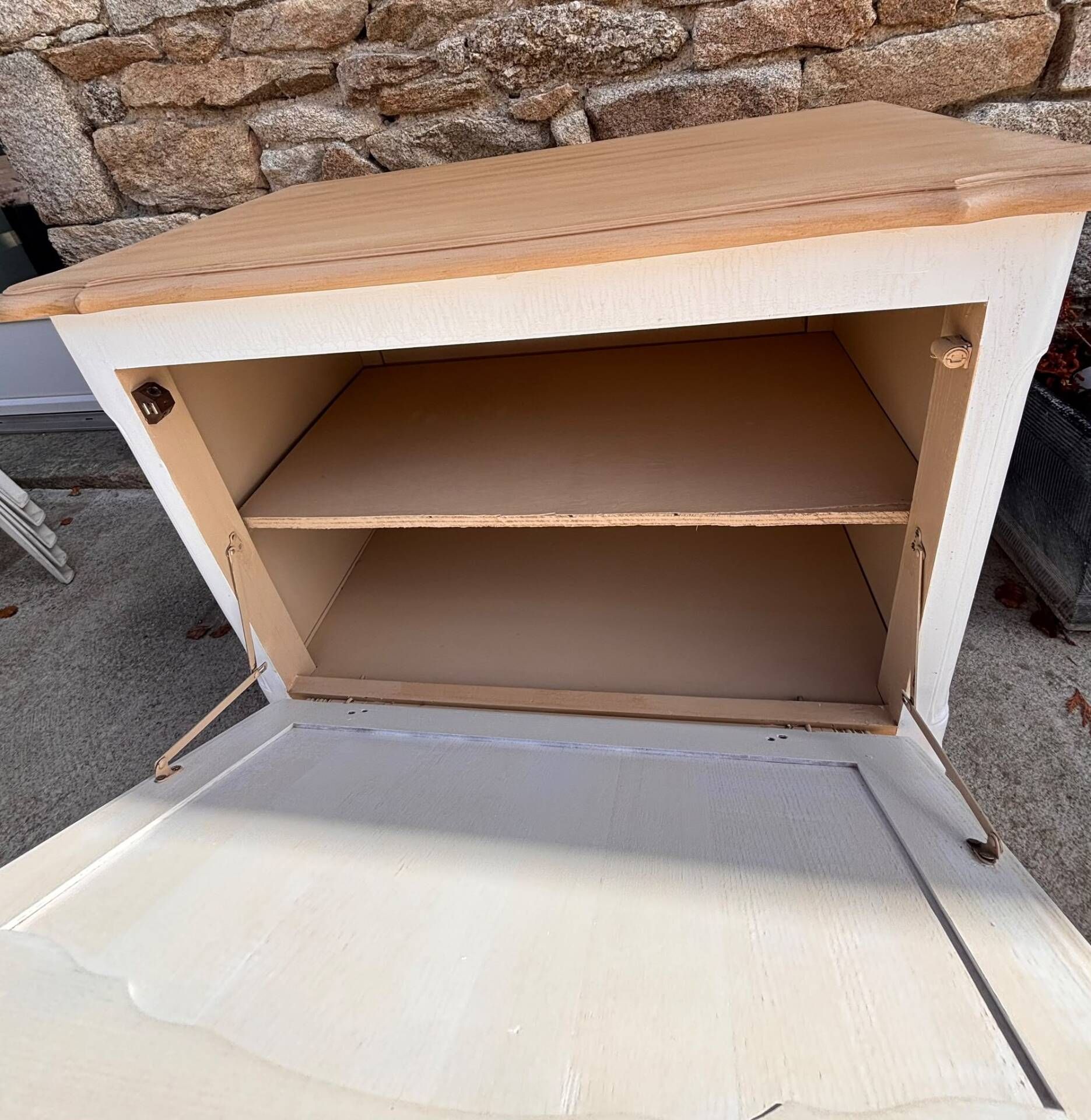 Renovated vintage furniture in raw wood and white.