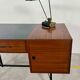 French modernist desk from the 1950s with 2 drawers, 1 cabinet, and 1 container.