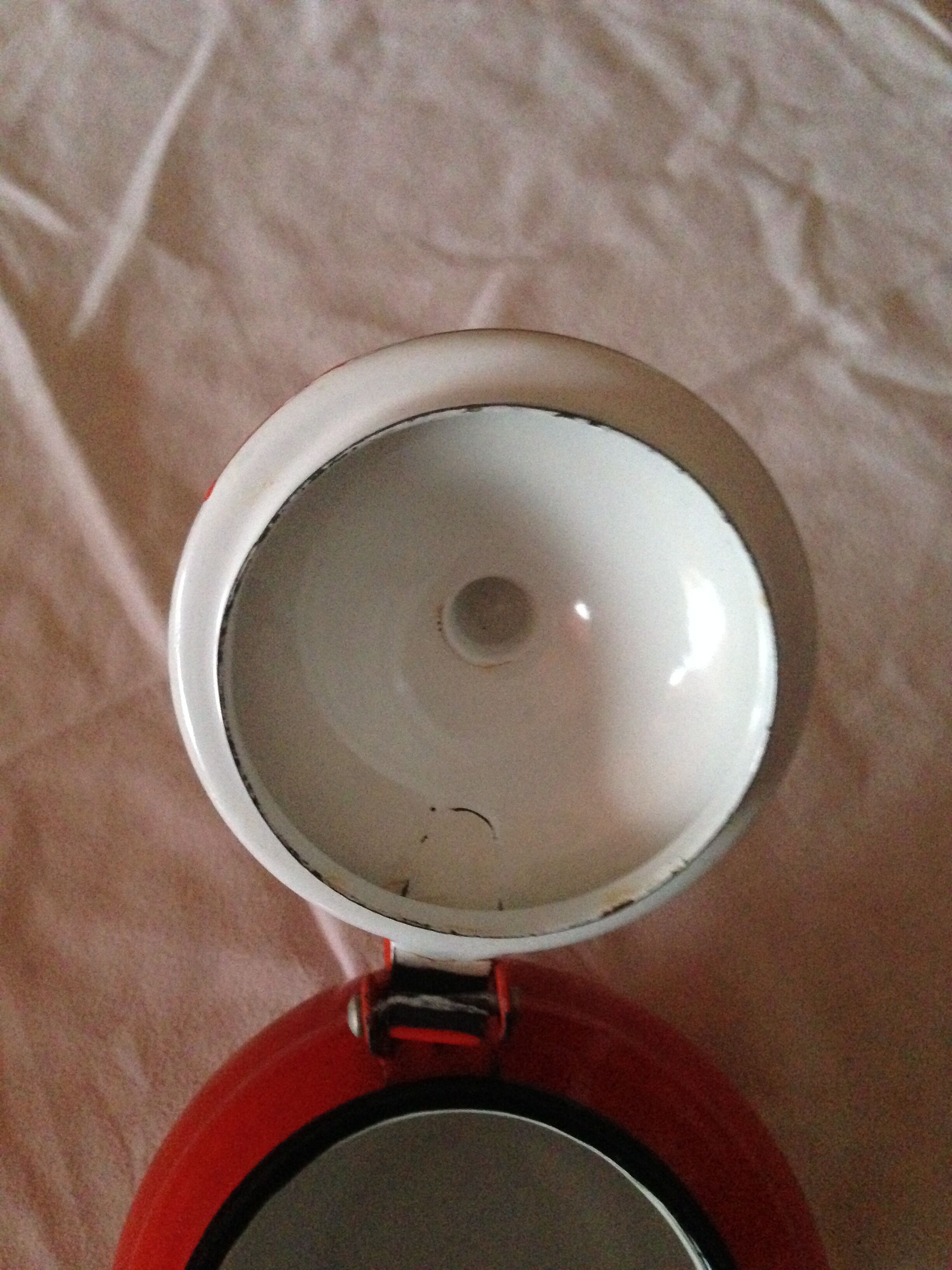 Small red metal teapot