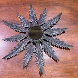 Metal mirror with foliage decoration