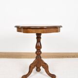 Pedestal table or side table, carved wooden legs, inlaid veneer on the top.