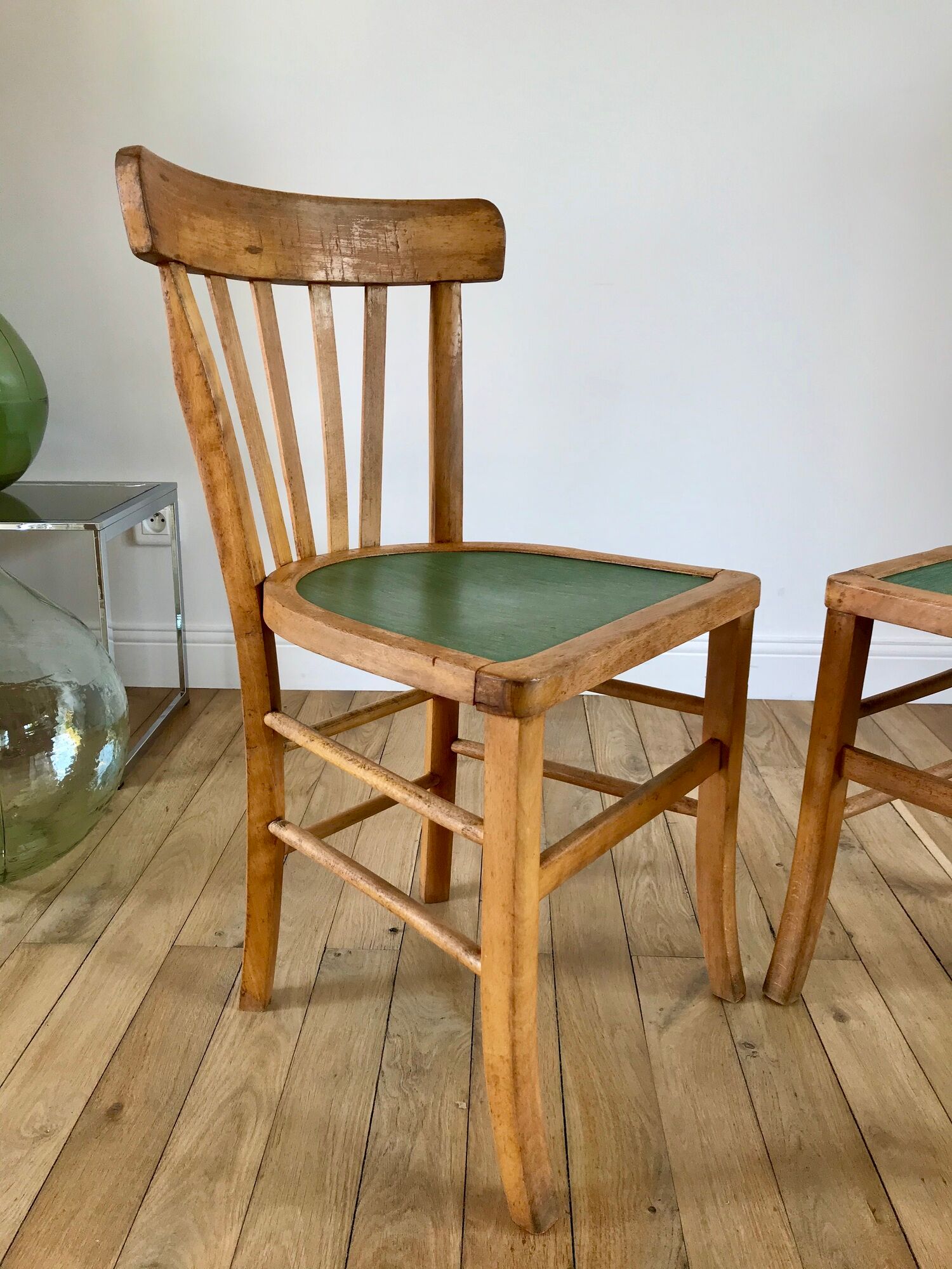 Pair of bistro chairs in light curved wood and green seat 1950s