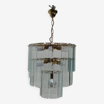 Chandelier in gilded brass surrounded by suspended beveled glasses, Italian manufacture