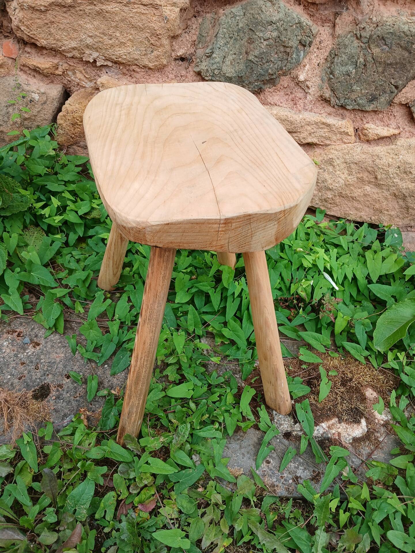 Antique stool in raw wood
