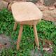 Antique stool in raw wood