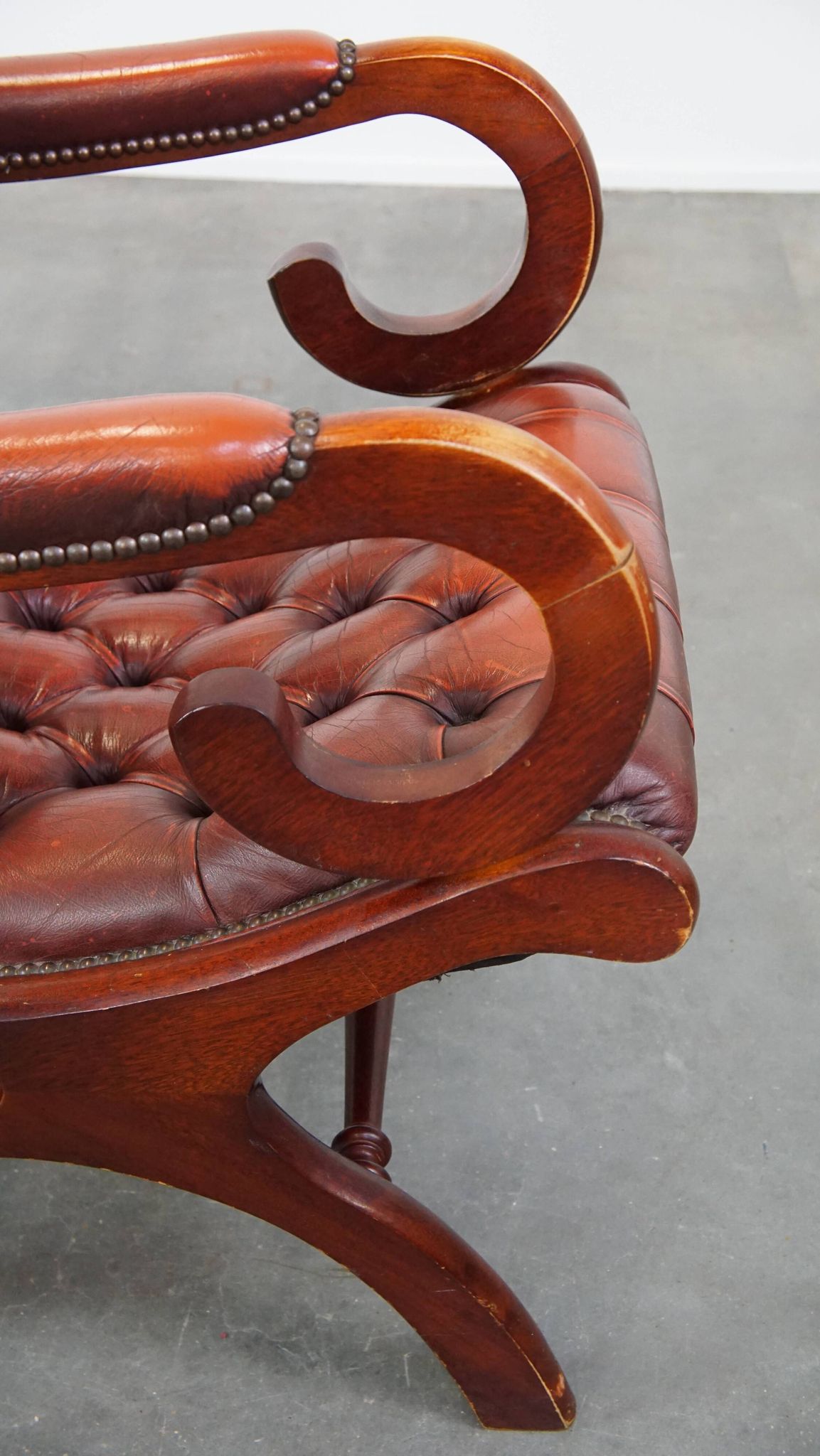 Red cowhide leather English Chesterfield armchair combined with wood