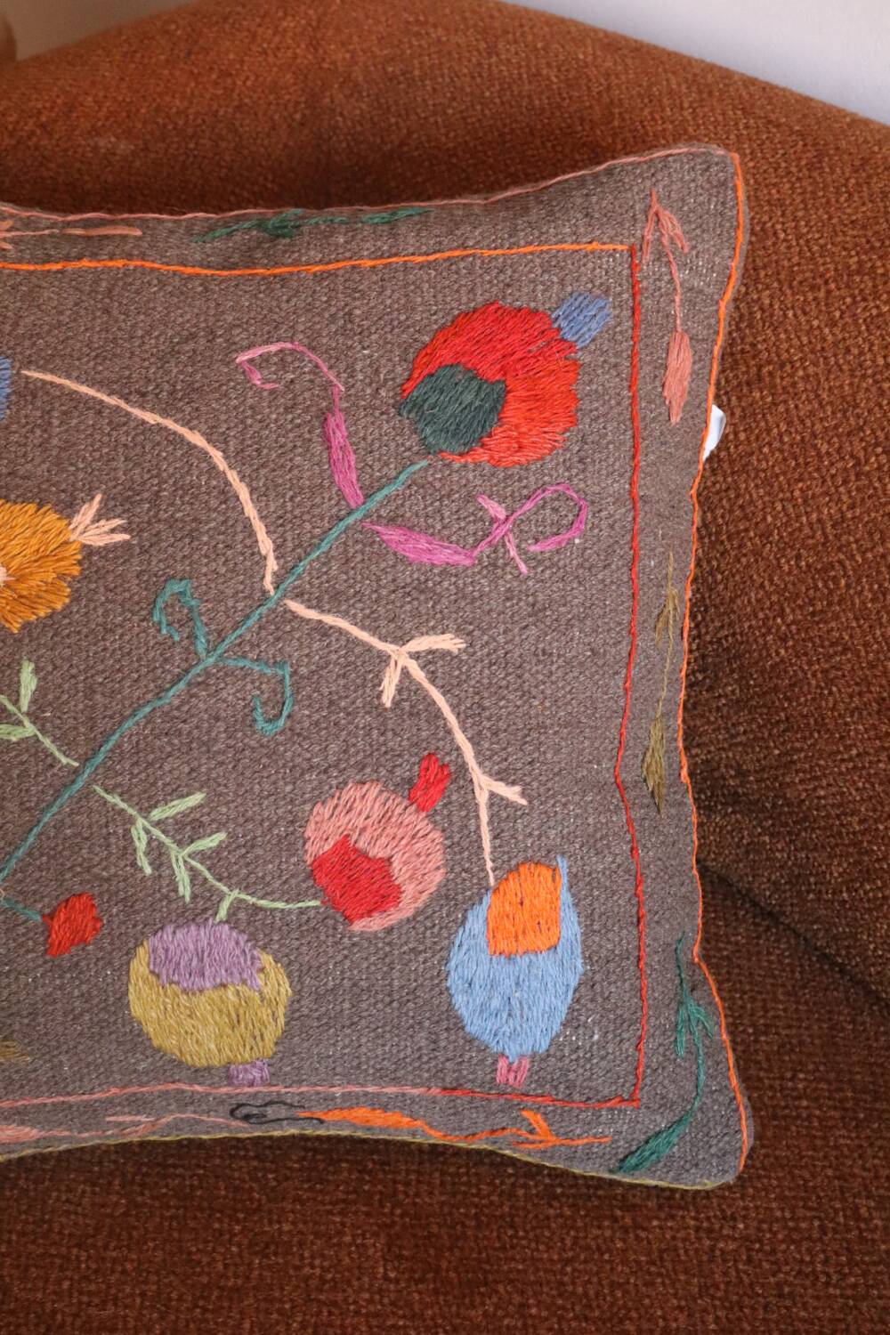 Colorful Suzani cushion in handmade embroidered wool