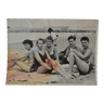 Old film photo circa 1950 the beach group of teenagers