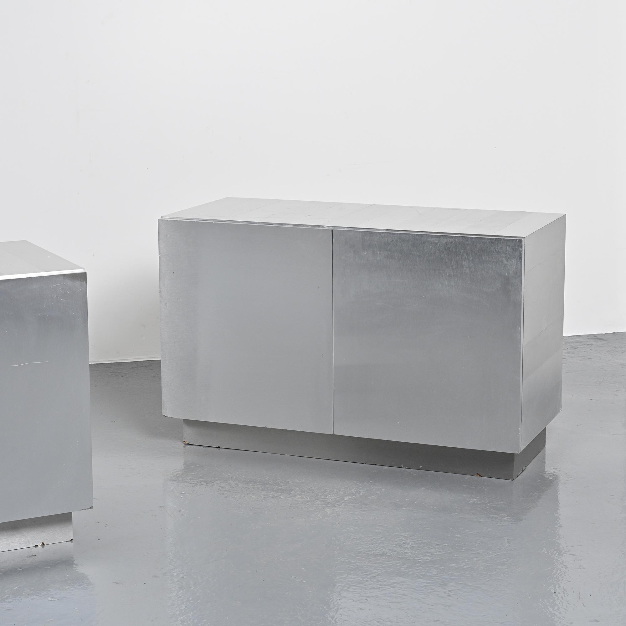 Pair of low buffets in brushed metal, French work, 1970s.
