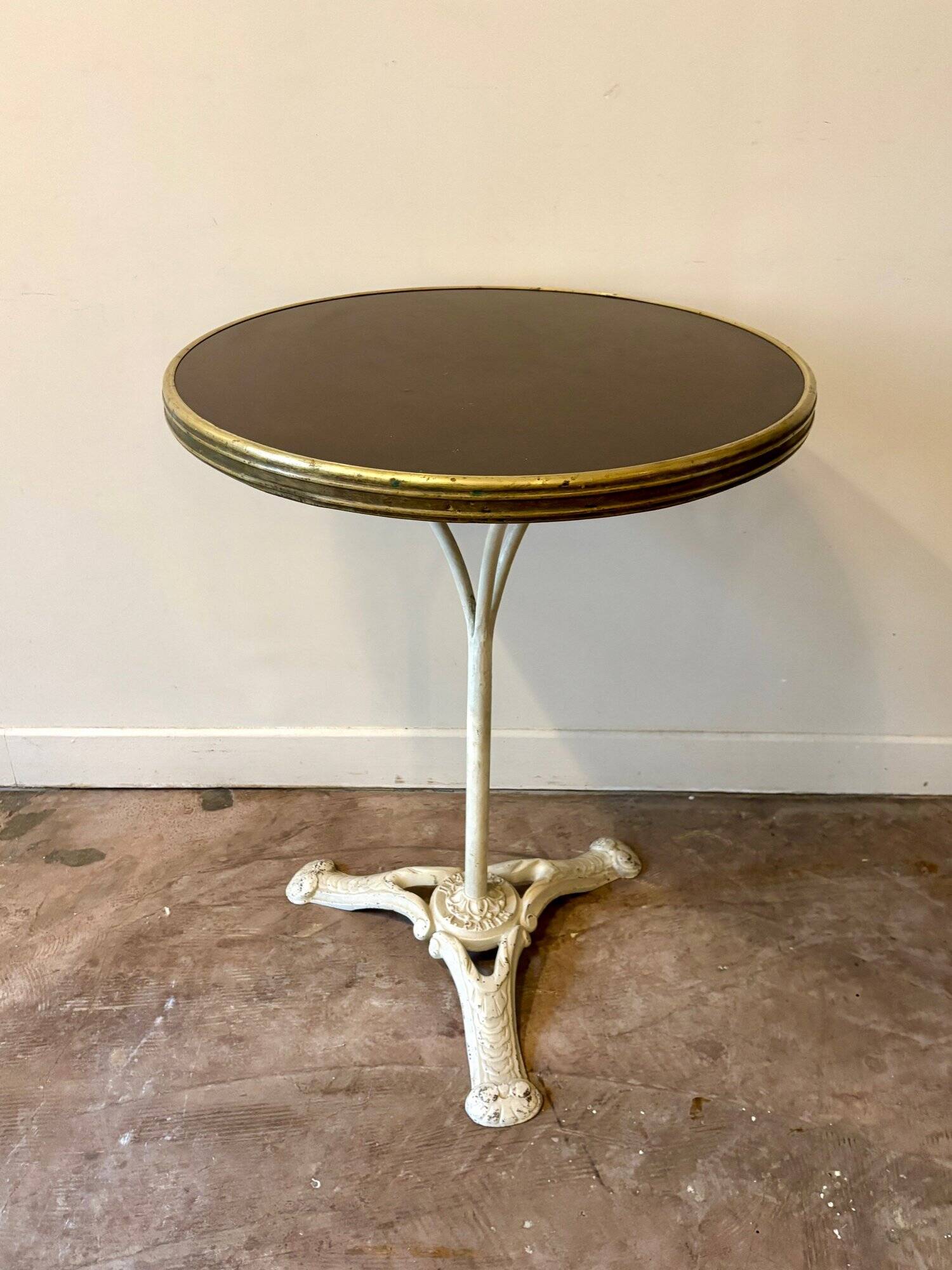 Bistro table in gray cast iron and brown melamine