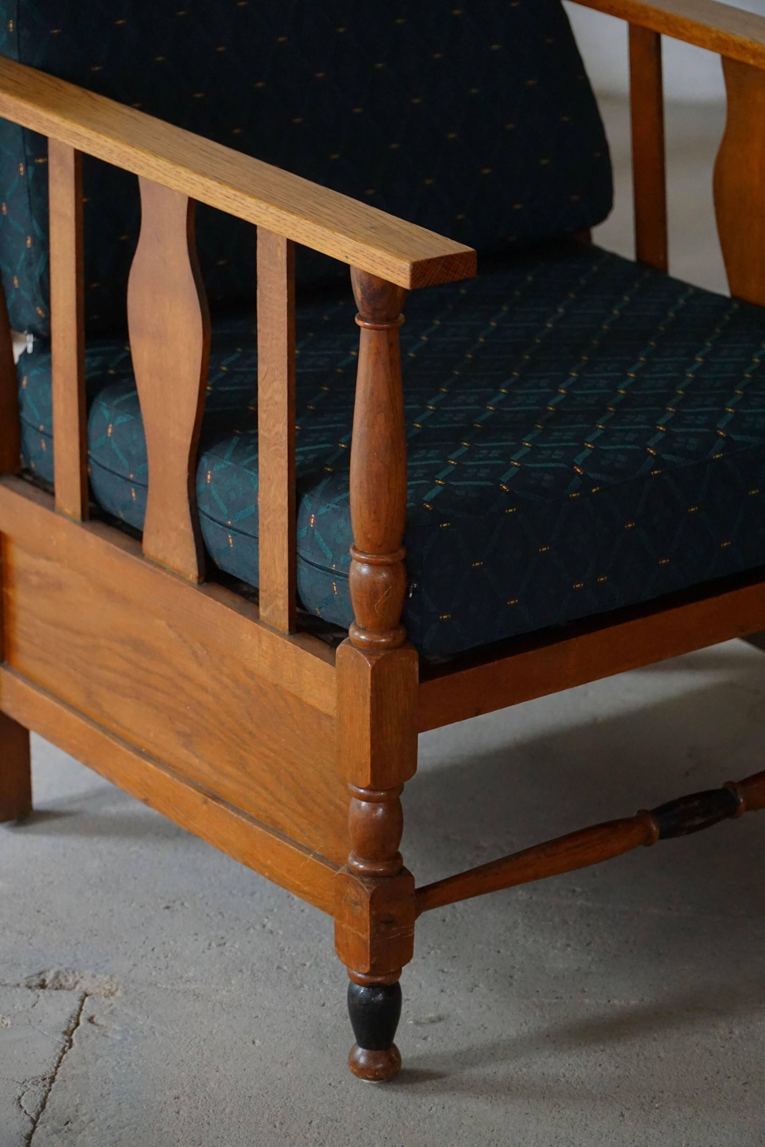 Art Nouveau, pair of oak lounge chairs, reupholstered in style fabric, 1920s.