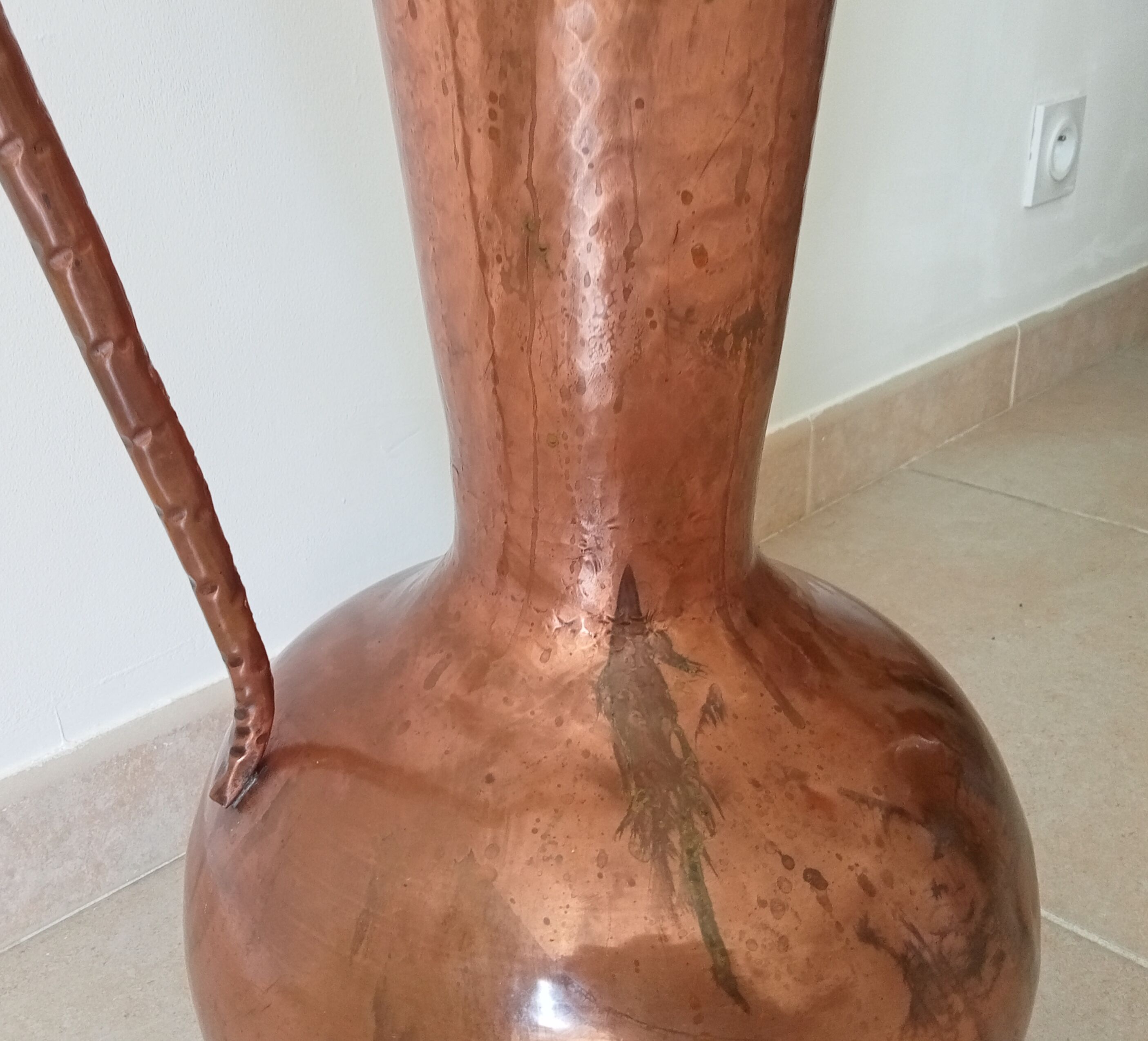 Old italian amphora vase in hammered copper