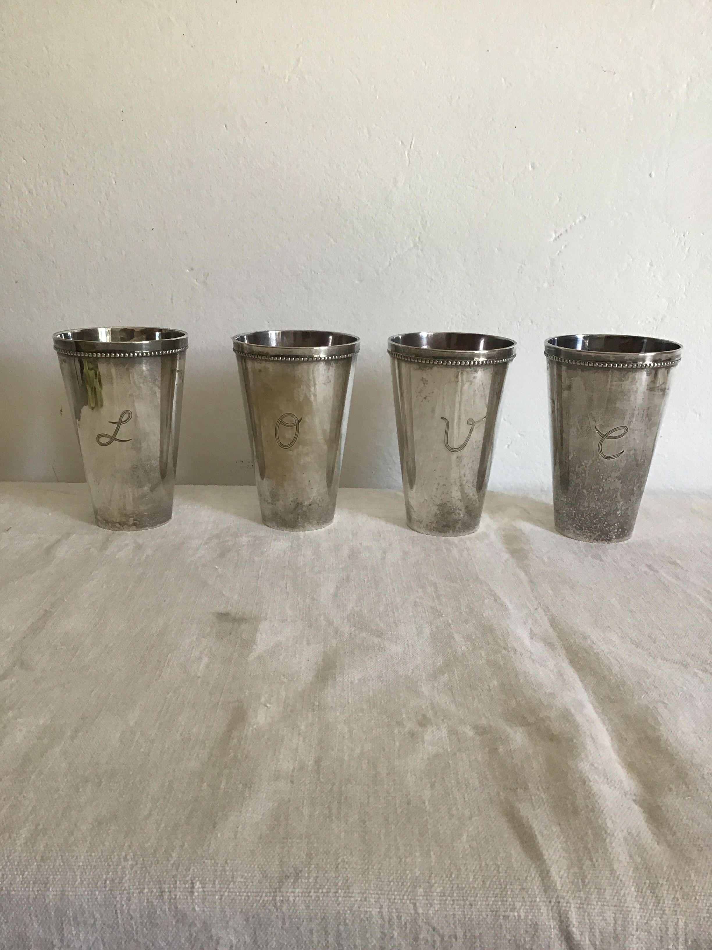 4 'love' metal vases