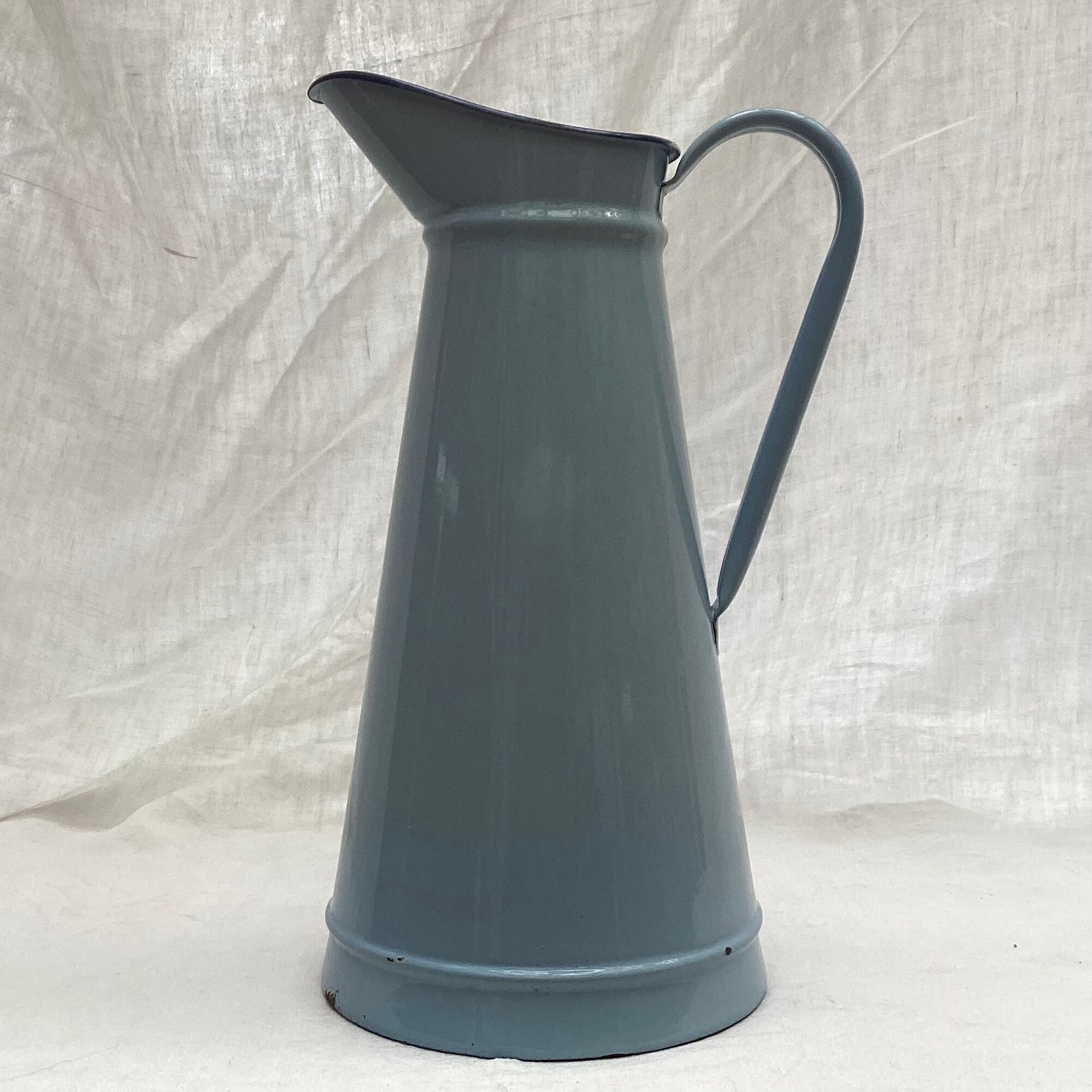 Old broc in enamelled sheet metal light blue color