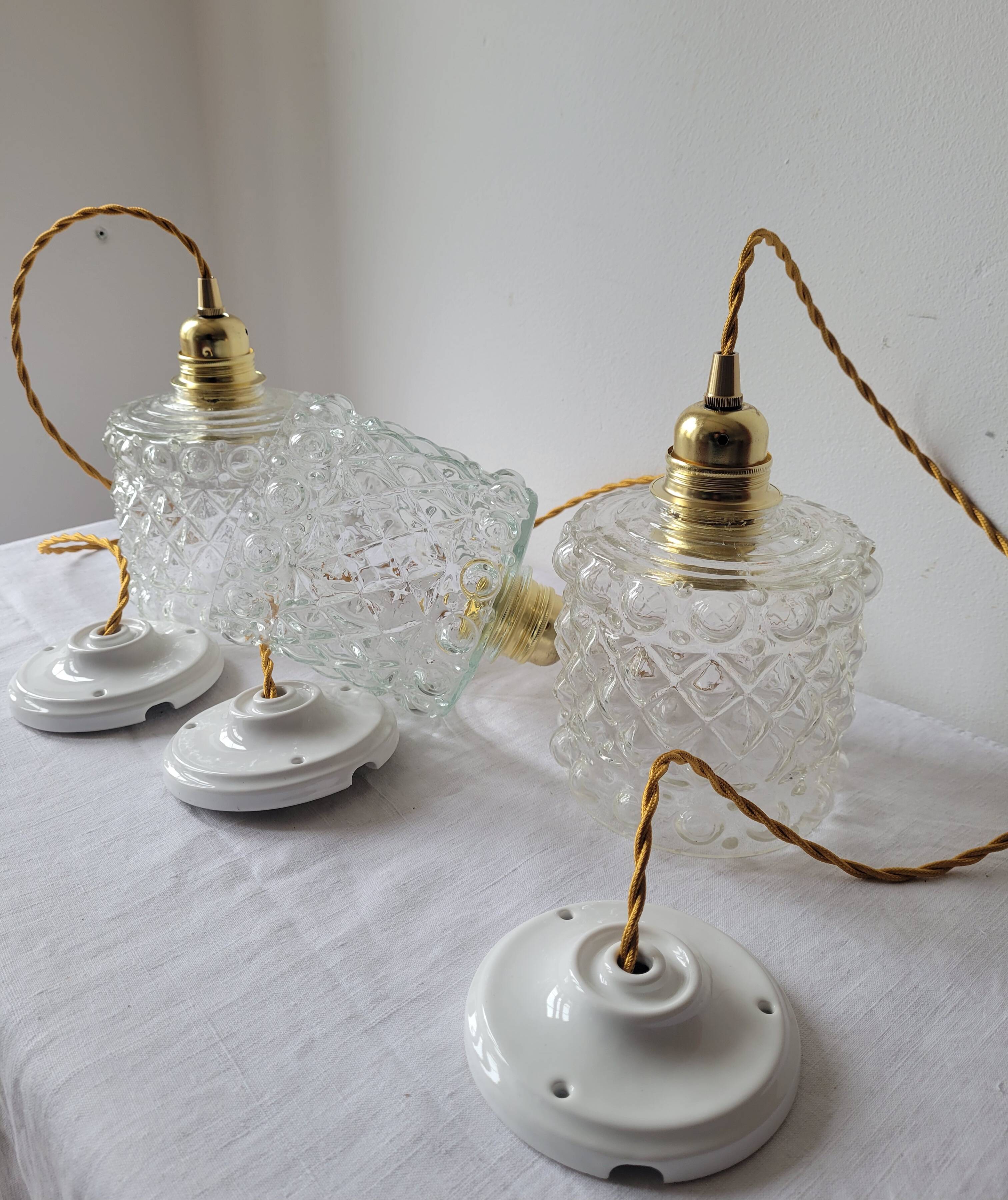 Trio of molded glass pendant lights