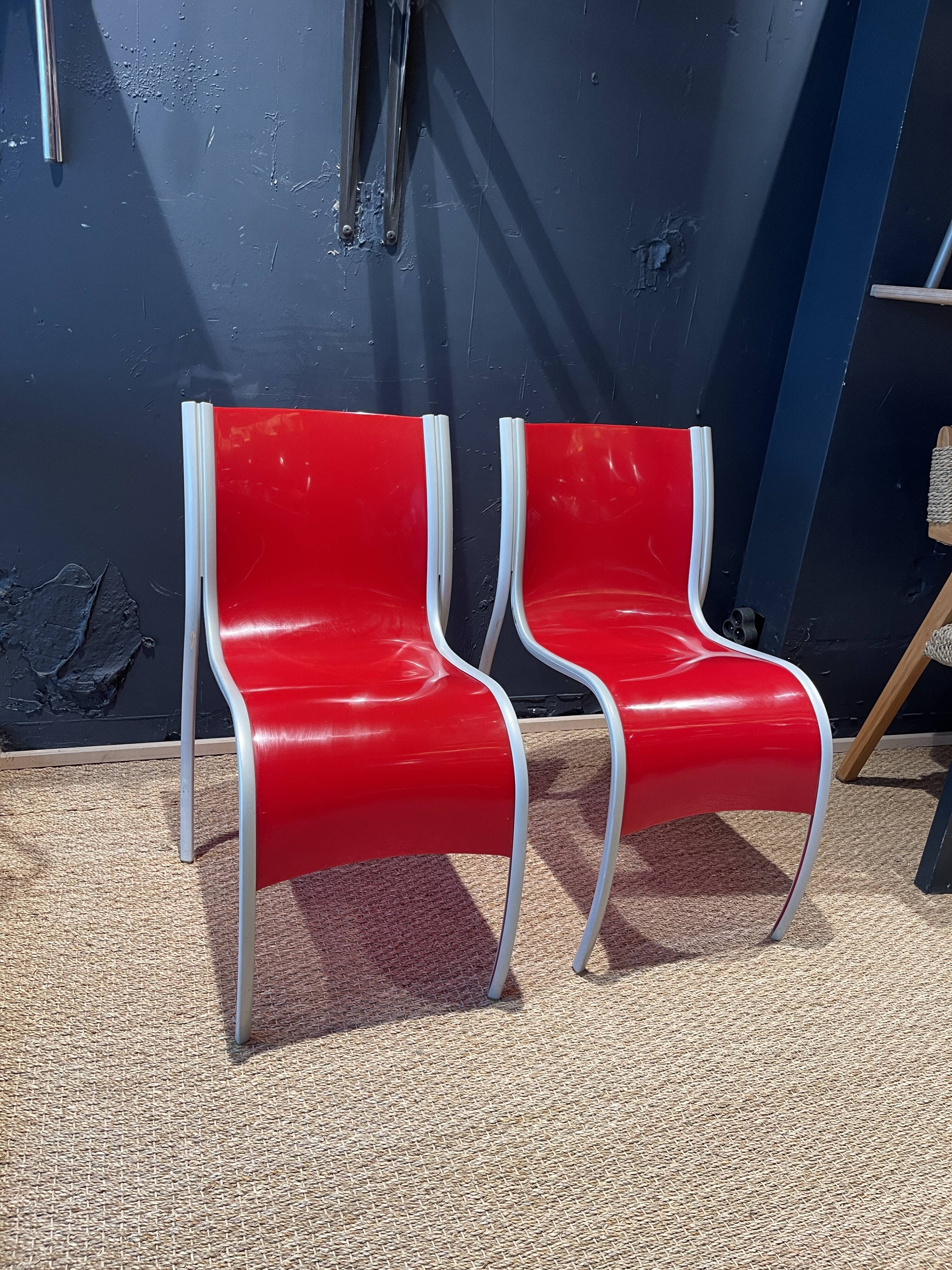 Pair of FPE chairs by Ron Arad for Kartell red Italy 2000s