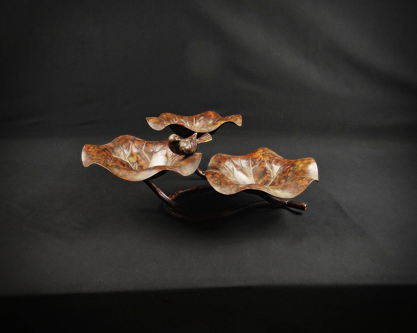 Three-tiered lotus leaf shaped patinated metal bird bath