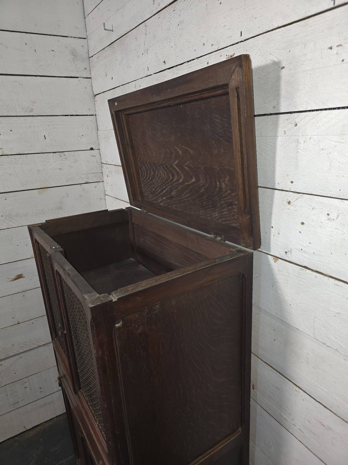 Vintage oak furniture with mesh doors.