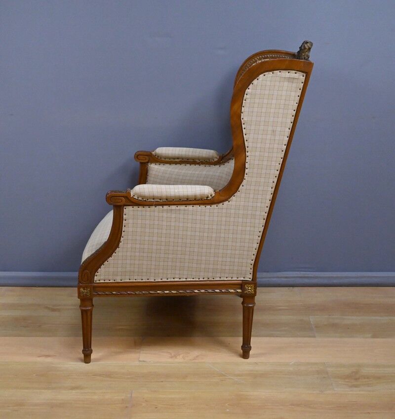 Wingback armchair in walnut, Louis XVI style – late 19th century