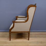 Wingback armchair in walnut, Louis XVI style – late 19th century
