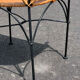 Wicker and black wrought iron armchair