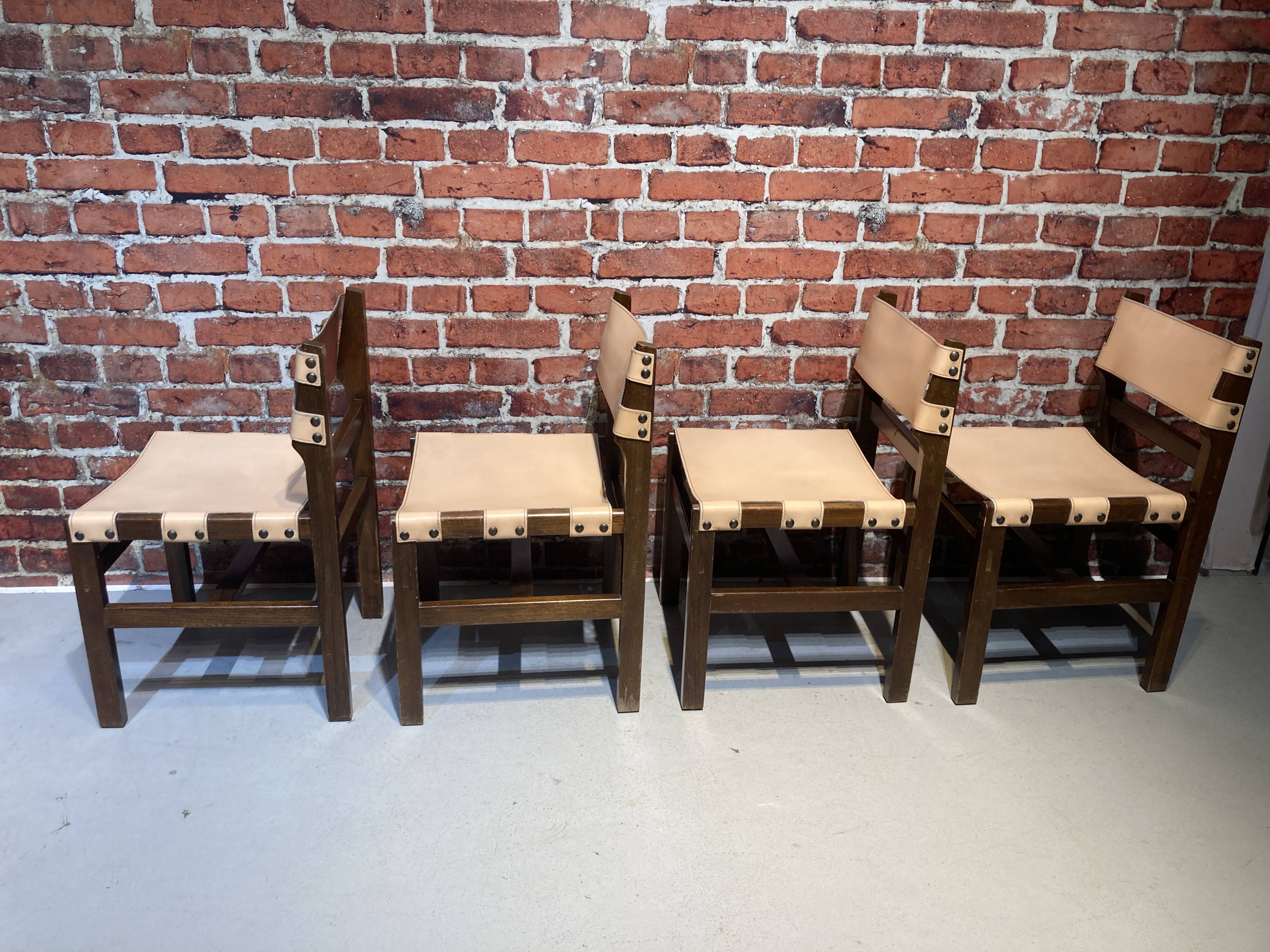 Set of four wooden and leather chairs from Maison Regain