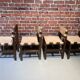 Set of four wooden and leather chairs from Maison Regain