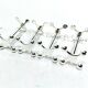 SET OF 12 SILVER-PLATED KNIFE RESTS