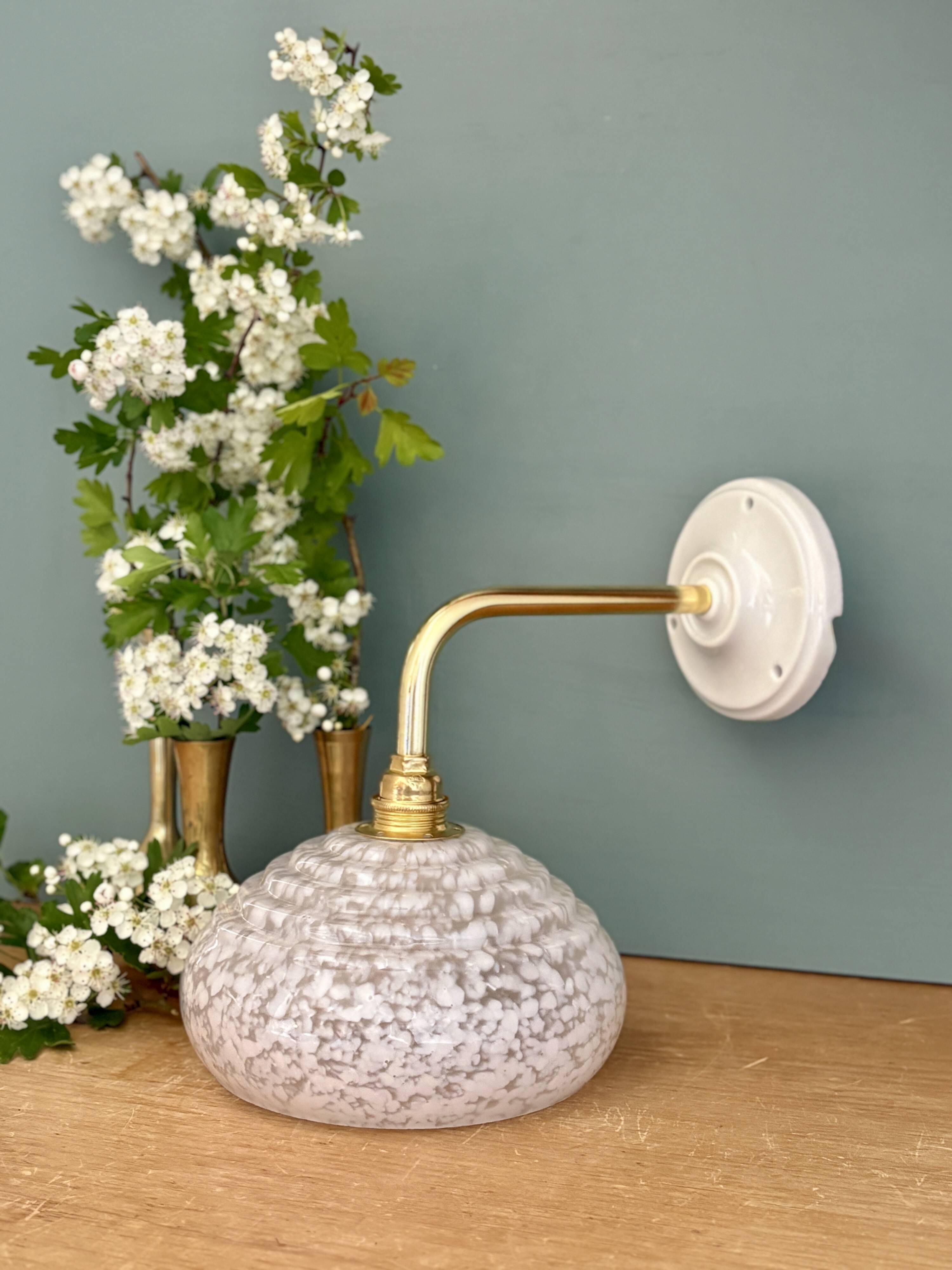 Vintage glass wall lamp with a white Clichy shade.