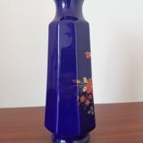 Vase bleu fleurs oranges et vertes