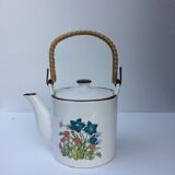 Vintage teapot with wicker handle