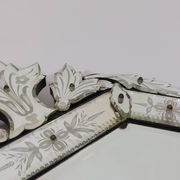 Venetian wall mirror in Murano glass with faceted floral decoration from the 1930s.