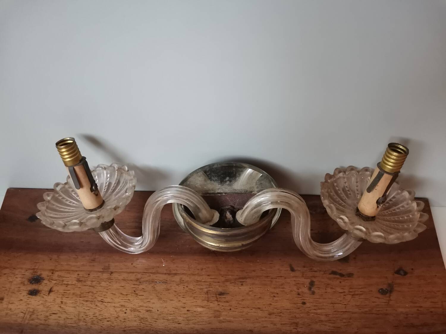 Old vintage wall lamp, brass glass and fake candle mirror