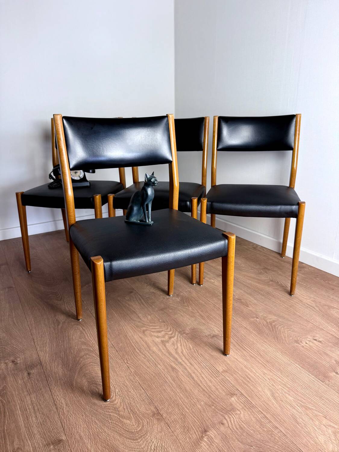 Set of 4 wooden and black leatherette chairs