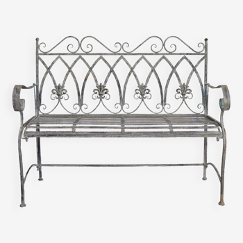 Garden bench with iron lily flowers