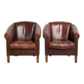 Set of 2 sheepskin club armchairs in a dark cognac colour