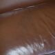 Contemporary Howard & Sons style grand sofa with brass casters.
