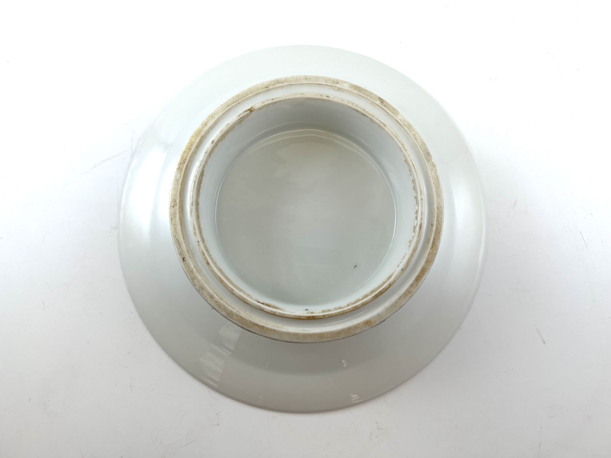Compotier or flat cut with monogrammed white biscuit cake