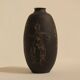 Ceramic vase decorated with women and a tree.