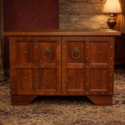 Traditional studded TV cabinet, inspired by heroic fantasy.