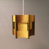 Older lamp in wood veneer, partially painted in green colour.