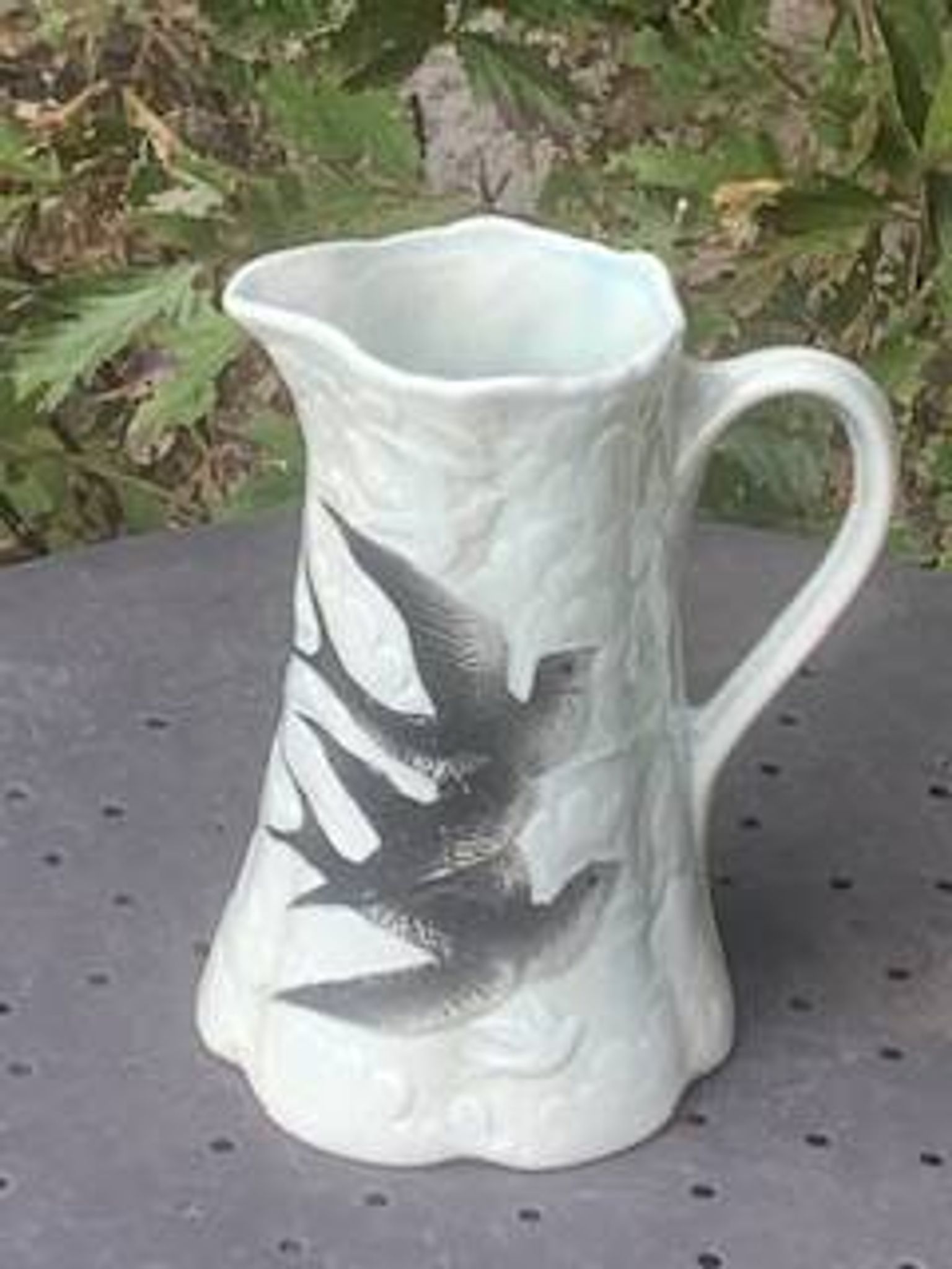 Jade green ceramic barbotine vase with swallows.