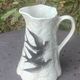 Jade green ceramic barbotine vase with swallows.
