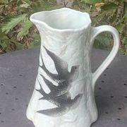 Jade green ceramic barbotine vase with swallows.