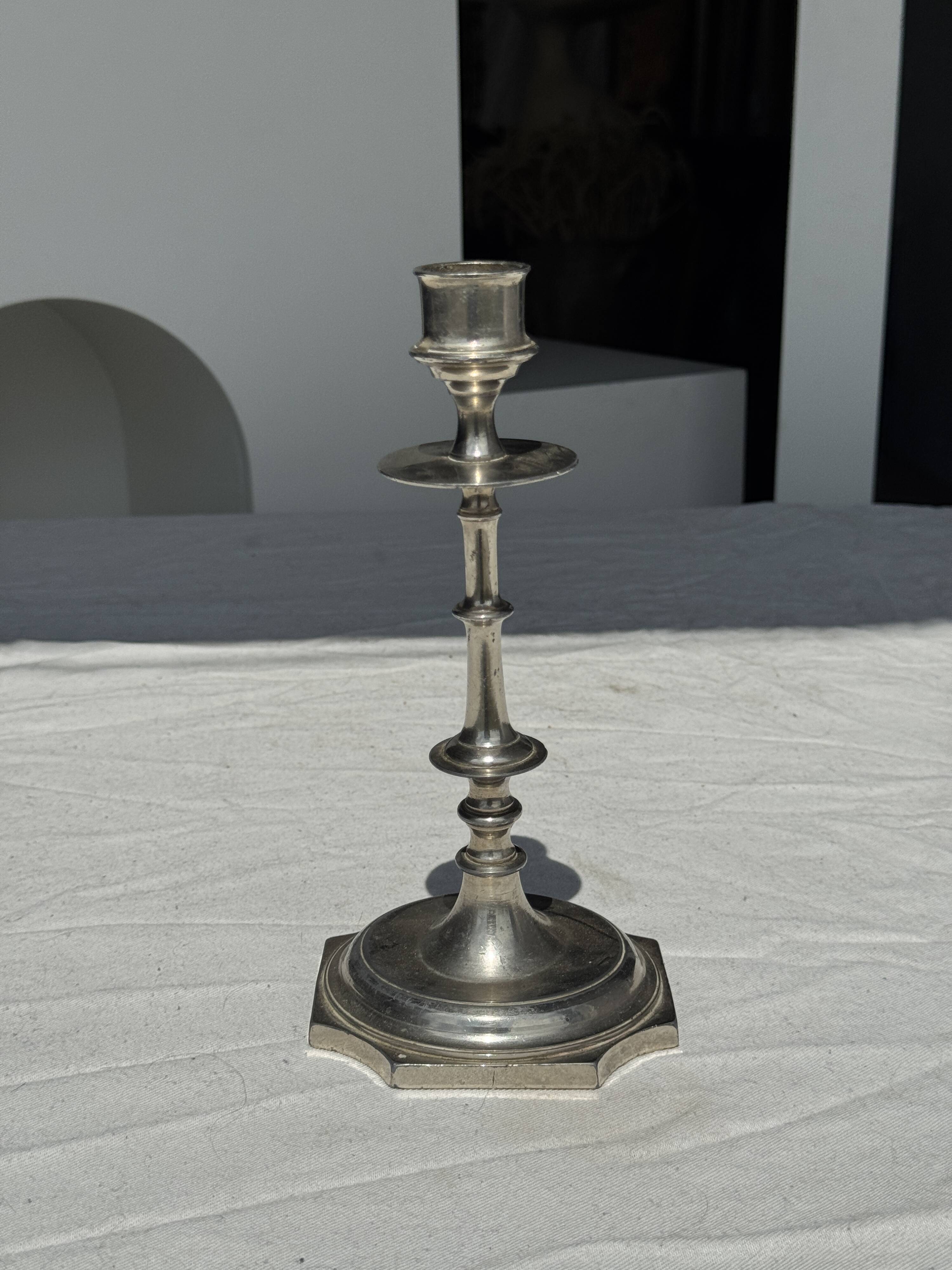 A large silver candlestick holder H23