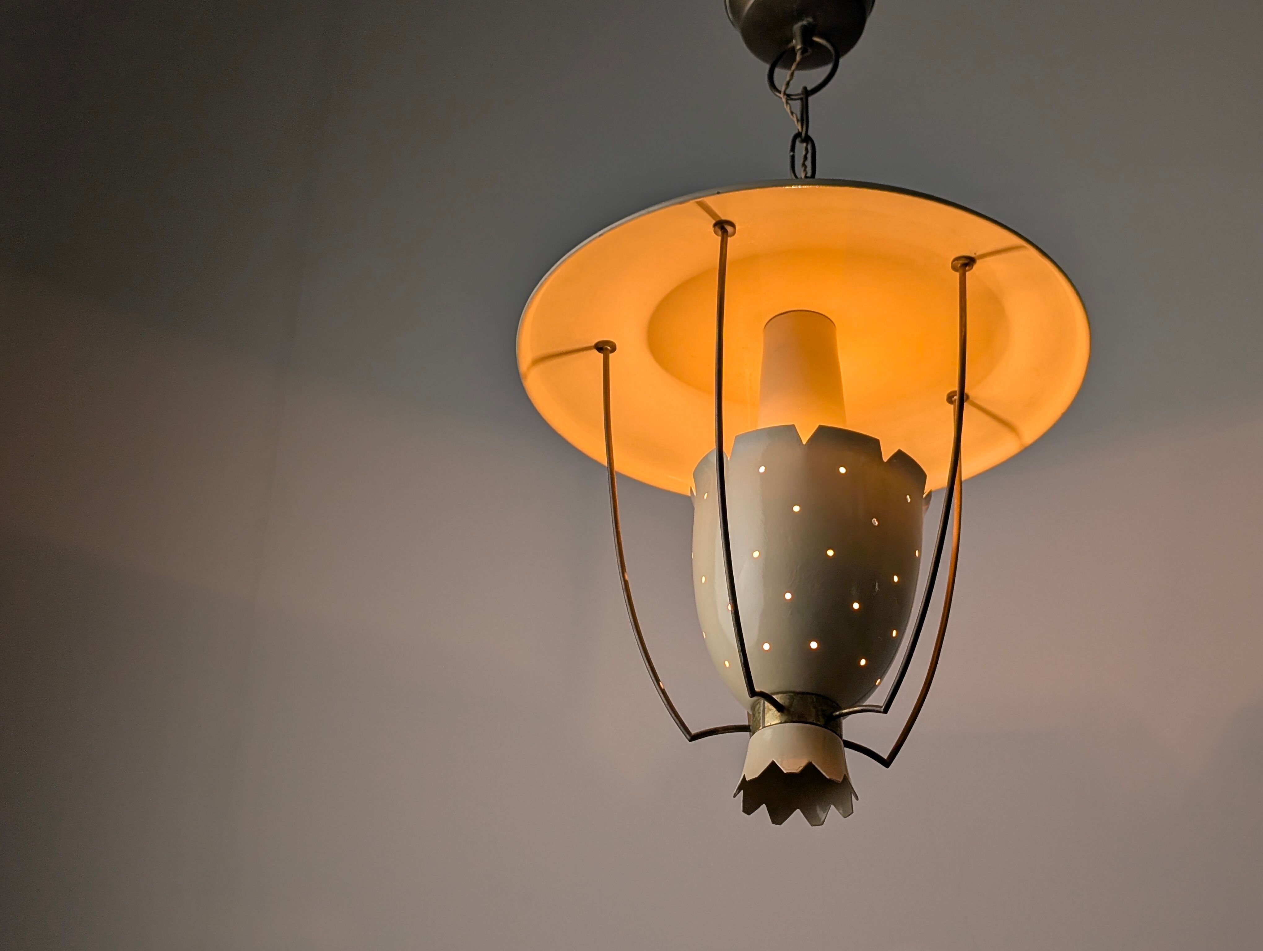 Perforated metal pendant lamp with brass details, Italy, 1940s