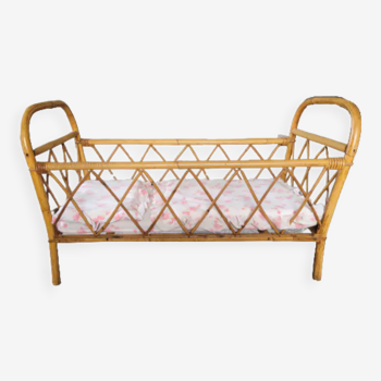 Vintage rattan and wicker doll bed